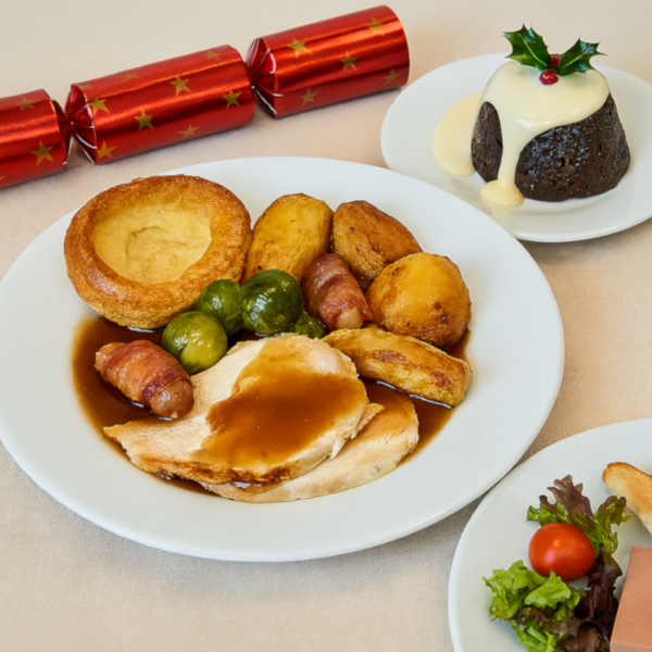 three course christmas dinner with a red cracker