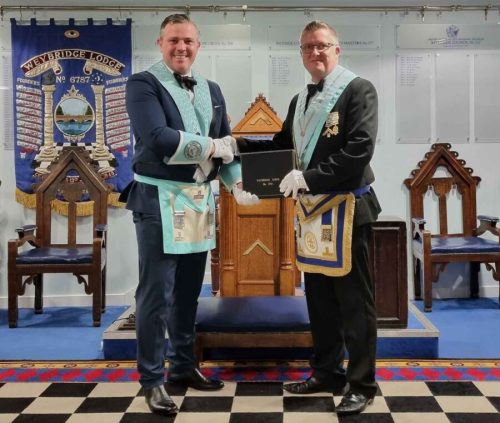 Weybridge Lodge Master Elect with Past Master Masonic Installation Meeting - Surrey Freemasons. What is freemasonry. Our newly installed worshipful master of the lodge is being congratulated by the outgoing past master,